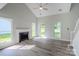 Bright living room with vaulted ceilings, fireplace, hardwood floors, and natural light at 7810 Trotter Rd, Charlotte, NC 28216