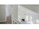 Open-concept living room with a vaulted ceiling, fireplace, and large windows for plenty of natural light at 7810 Trotter Rd, Charlotte, NC 28216