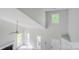 Bright living room features high ceilings, a fireplace, and large windows, creating an airy and welcoming space at 7810 Trotter Rd, Charlotte, NC 28216