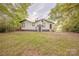 Backyard with mature trees and green grass, ideal for outdoor fun at 8 Bolt Dr, Shelby, NC 28150