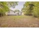 Spacious backyard with mature trees and green grass, perfect for outdoor activities at 8 Bolt Dr, Shelby, NC 28150