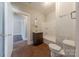 Bathroom with hardwood floors, toilet, sink, and shower/tub combination at 8 Bolt Dr, Shelby, NC 28150