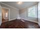 Cozy bedroom featuring hardwood floors and natural light from a window at 8 Bolt Dr, Shelby, NC 28150