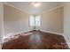 Bright bedroom featuring hardwood floors and corner windows for natural light at 8 Bolt Dr, Shelby, NC 28150