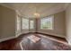 Dining room featuring hardwood floors, a chandelier, and bright windows offering plenty of natural light at 8 Bolt Dr, Shelby, NC 28150