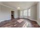 Open dining room with hardwood floors, crown molding, and natural light from windows at 8 Bolt Dr, Shelby, NC 28150