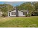Charming single-story home with traditional architecture and mature trees in a green front yard at 8 Bolt Dr, Shelby, NC 28150
