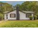 Charming single-story home featuring a black brick chimney and complemented by mature trees at 8 Bolt Dr, Shelby, NC 28150