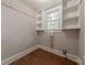 The laundry room features built-in shelving and a window for natural light at 8 Bolt Dr, Shelby, NC 28150