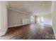 Expansive living room with hardwood floors, fireplace, neutral paint, and ample natural light at 8 Bolt Dr, Shelby, NC 28150