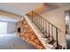 Open basement area featuring a staircase, brick fireplace, and lots of potential at 910 Surry Dr, Shelby, NC 28152