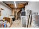 Unfinished basement with exposed ceilings and brick, offering potential for customization at 910 Surry Dr, Shelby, NC 28152