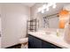 Bathroom featuring a sink and vanity, toilet, shower/tub combo with shower curtain, and storage shelves at 910 Surry Dr, Shelby, NC 28152