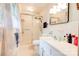 Bathroom with white fixtures, tile floor, and enclosed shower at 910 Surry Dr, Shelby, NC 28152