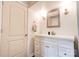 Clean bathroom featuring a white vanity with storage, a framed mirror, and modern lighting fixtures at 910 Surry Dr, Shelby, NC 28152