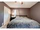 Bedroom with plush blanket on bed, closet, a ceiling fan, and a window with curtains at 910 Surry Dr, Shelby, NC 28152