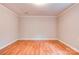 Simple empty bedroom with hardwood floors, neutral walls, and ample space at 910 Surry Dr, Shelby, NC 28152