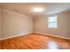 Empty bedroom features hardwood floors, neutral walls, and a window at 910 Surry Dr, Shelby, NC 28152