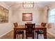 Cozy dining area features a wooden table with seating for four and a modern lighting fixture at 910 Surry Dr, Shelby, NC 28152