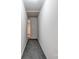 Hallway with neutral carpeting and white walls, leading to other rooms in the home at 910 Surry Dr, Shelby, NC 28152