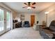 Spacious room includes a ceiling fan, access to the backyard, and ample seating at 910 Surry Dr, Shelby, NC 28152