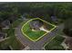 Aerial view showcasing the perimeter of the two-story home in a lush, wooded neighborhood at 914 Olive Mill Ln, Matthews, NC 28104