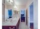 Bathroom features a double vanity, a framed mirror, and an open doorway at 914 Olive Mill Ln, Matthews, NC 28104