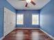 The bedroom features hardwood floors, white trim, and plenty of natural light at 914 Olive Mill Ln, Matthews, NC 28104
