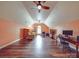 Large bonus room with hardwood floors, multiple ceiling fans, and lots of natural light at 914 Olive Mill Ln, Matthews, NC 28104