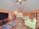 Spacious bonus room featuring vaulted ceilings, hardwood floors, and a ceiling fan at 914 Olive Mill Ln, Matthews, NC 28104