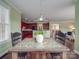 Dining room with table setting that provides open concept views of the kitchen and living spaces at 914 Olive Mill Ln, Matthews, NC 28104