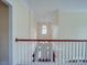Grand foyer with hardwood floors, staircase, and chandelier at 914 Olive Mill Ln, Matthews, NC 28104