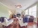 Spacious living room with hardwood floors, fireplace, and natural light at 914 Olive Mill Ln, Matthews, NC 28104