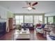 Bright living room with hardwood floors, fireplace and many windows at 914 Olive Mill Ln, Matthews, NC 28104