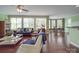 Spacious living room with hardwood floors and large windows provides an abundance of natural light at 914 Olive Mill Ln, Matthews, NC 28104
