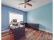 The office space is equipped with hardwood floors, an expansive window, and a ceiling fan at 914 Olive Mill Ln, Matthews, NC 28104