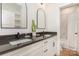 Bright bathroom with double vanity and a walk-in shower with marble tile at 933 Tennyson Dr, Charlotte, NC 28208