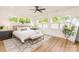 Primary bedroom with hardwood floors, a large window and a bench at 933 Tennyson Dr, Charlotte, NC 28208