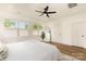 Primary bedroom with hardwood floors, a large window and a bench at 933 Tennyson Dr, Charlotte, NC 28208
