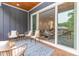Spacious deck with comfortable seating and an open doorway to the living room at 933 Tennyson Dr, Charlotte, NC 28208