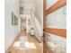Welcoming entryway with light wood floors, an open staircase, and stylish decor setting a warm tone at 933 Tennyson Dr, Charlotte, NC 28208