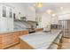 Bright kitchen features marble countertops, stainless steel appliances and a large island at 933 Tennyson Dr, Charlotte, NC 28208