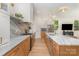 Bright kitchen featuring marble countertops, stainless steel appliances, and an open layout, ideal for modern living at 933 Tennyson Dr, Charlotte, NC 28208