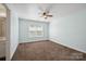 Bedroom with carpet and a window with blinds at 10101 Bayart Way, Huntersville, NC 28078