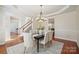 Bright dining room with table, seating for six, and views to the entry and office at 10101 Bayart Way, Huntersville, NC 28078