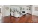 Inviting living room featuring hardwood floors, a fireplace, and built-in bookshelves at 10101 Bayart Way, Huntersville, NC 28078