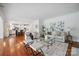 Bright, open living area with hardwood floors flows into a modern kitchen, perfect for entertaining at 10101 Bayart Way, Huntersville, NC 28078