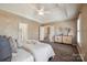 Spacious main bedroom with elegant tray ceilings, neutral tones, and a view to a secondary floor at 10101 Bayart Way, Huntersville, NC 28078