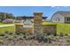 Bell Farm community entrance sign featuring stone pillar and landscaping at 103 White Apple Way, Statesville, NC 28625