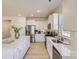 Spacious kitchen with white cabinets, stainless steel appliances, and a large central island with quartz countertops at 103 White Apple Way, Statesville, NC 28625